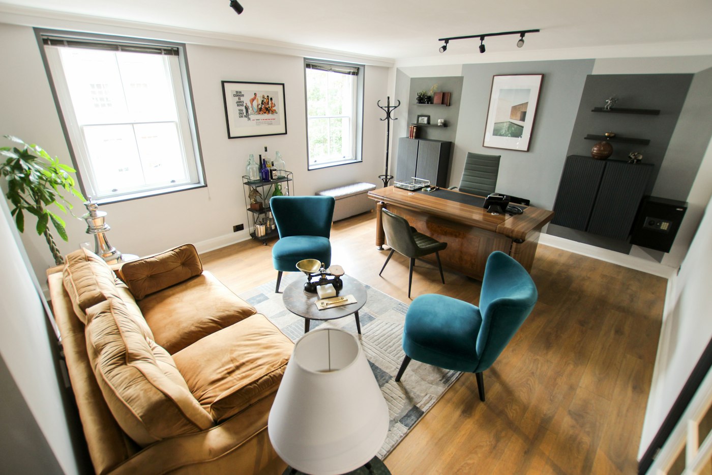 Finished open-plan living room with timber floors and a low sofa